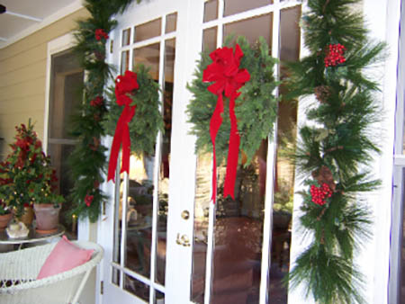 Hang matching wreaths on every window in your house.