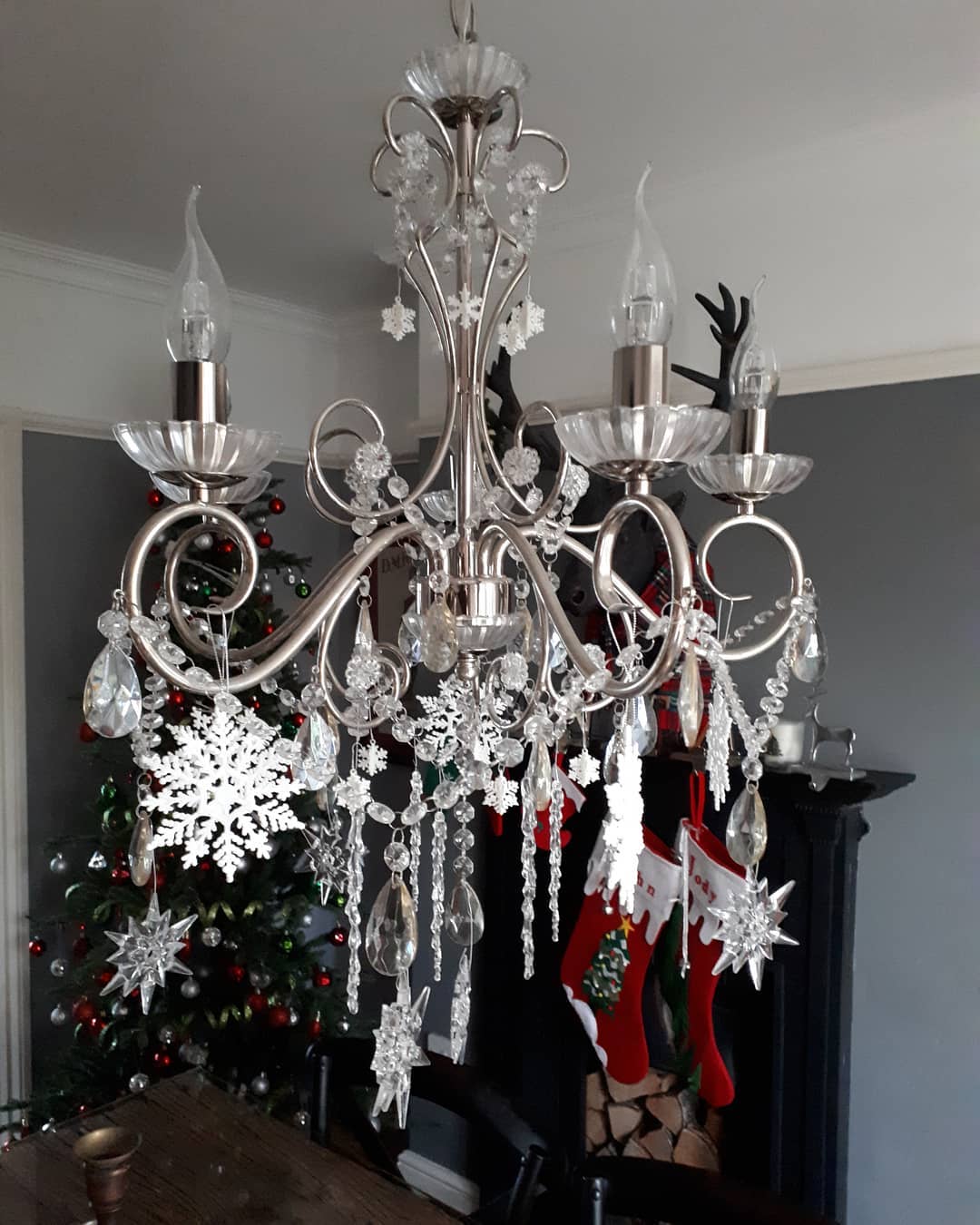 Festive chandelier with the addition of snowflakes and icicles.