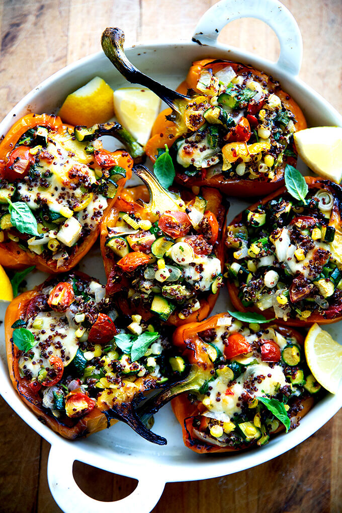 Roasted Peppers Stuffed with Corn, Zucchini, Quinoa, & Tomatoes