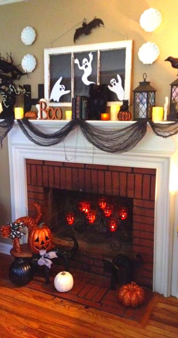 Black cheese cloth to look like webs pumpkins crows and ghost to decorate mantel.