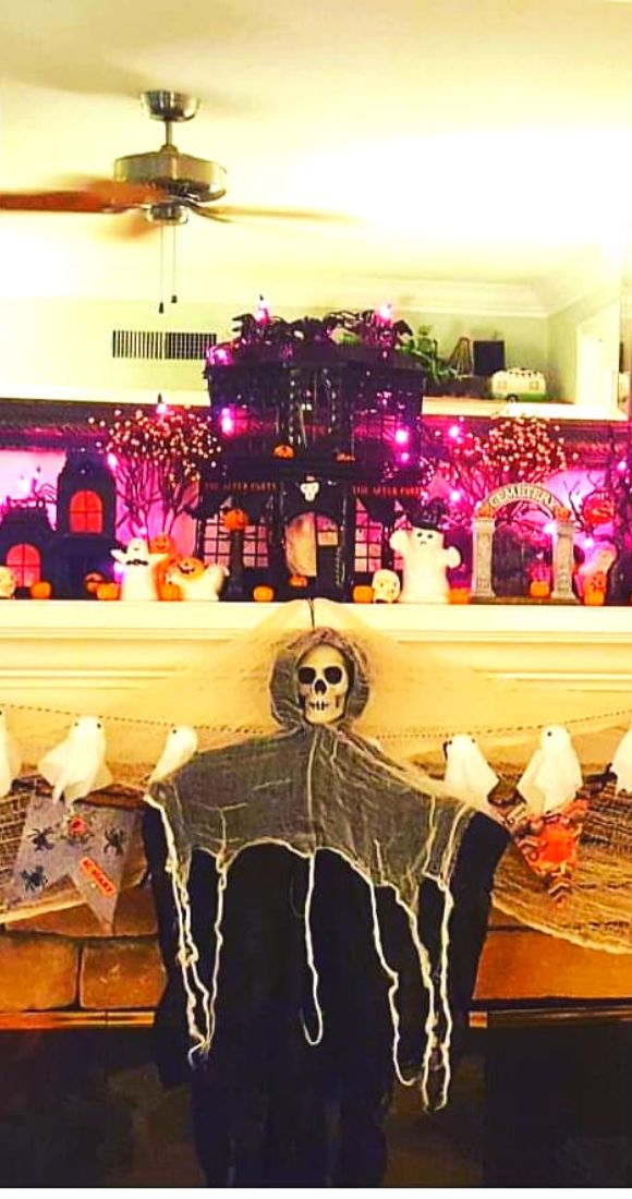 Cute ghost garland skeleton and lights for Halloween Mantel decor.
