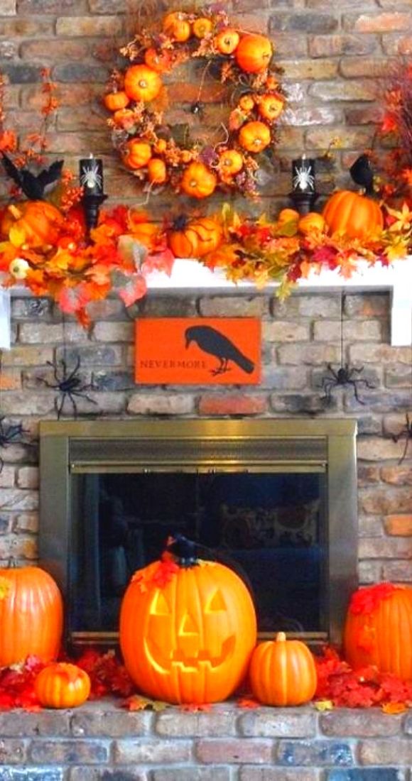 Gorgeous fireplace mantel decor with pumpkins.