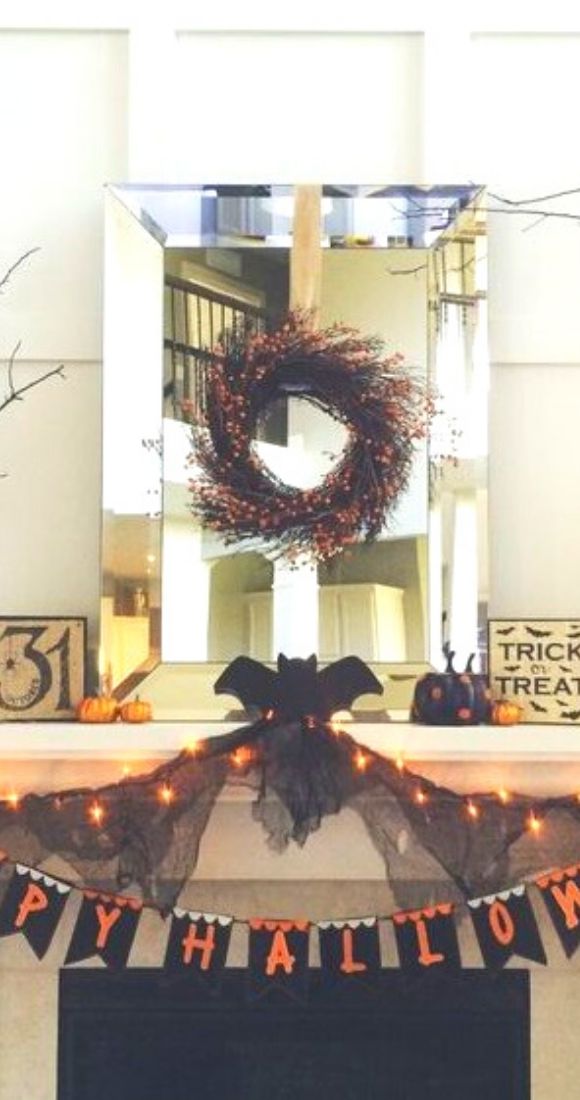Happy Halloween garland wreath and lights for beautiful mantel decor.
