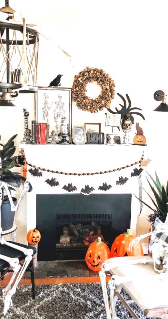 Skeleton are busy in discussion with this awesome mantel decor.