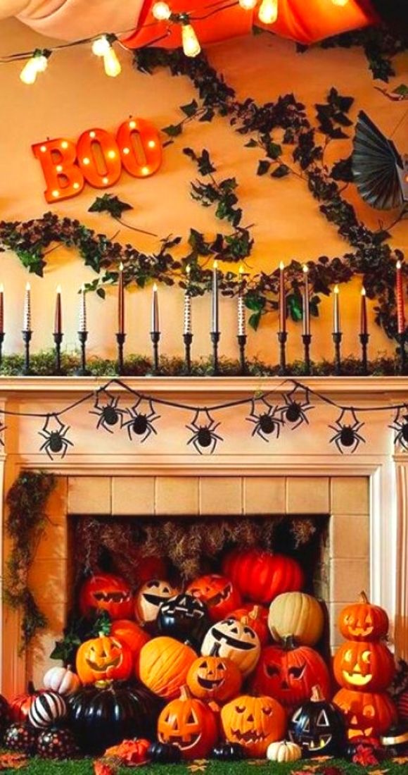 Spider garland tree bats pumpkins and BOO to decorate to mantel for Halloween.