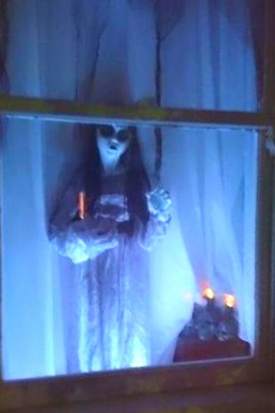 Creepy Girl Halloween window.