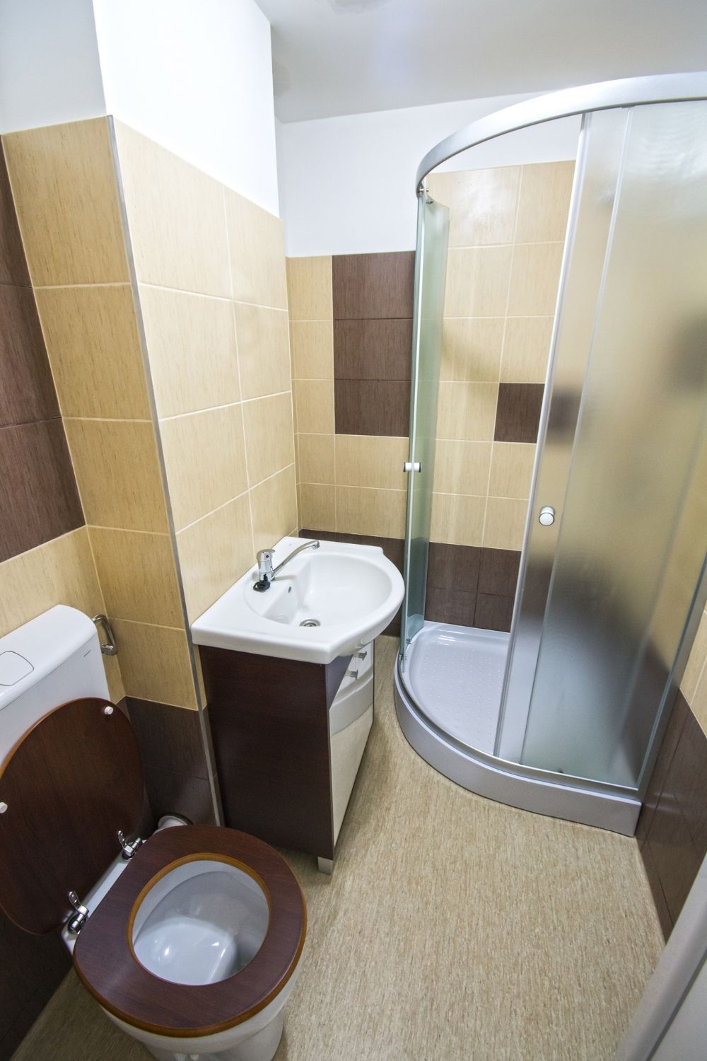 A wall-mounted sink with floating vanity