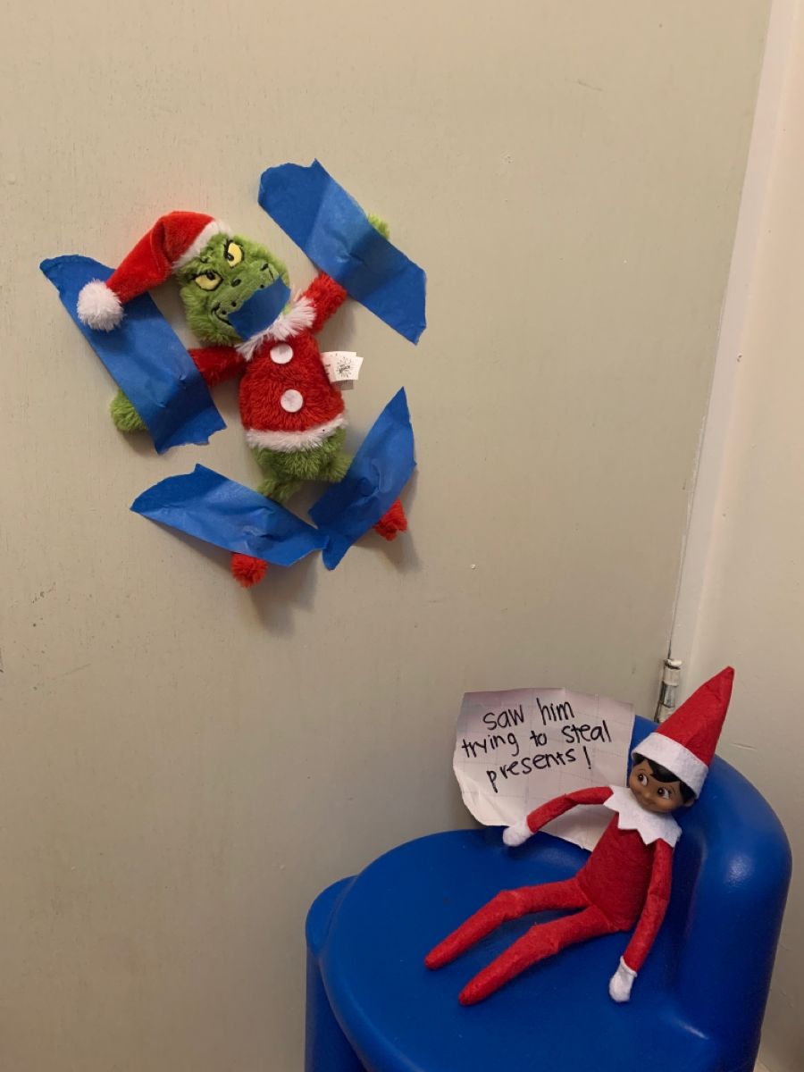 Elf punishing Grinch