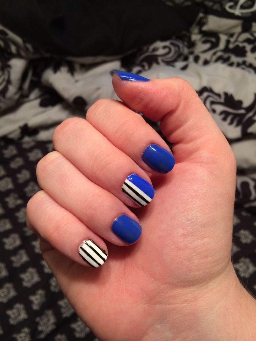 Blue black and white nail art with stripes